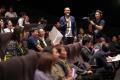 全社員が映画館に集結！年に一度の伝統行事「全体会議