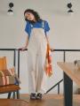 「human woman」から、「UNIVERSAL OVERALL」とのコラ